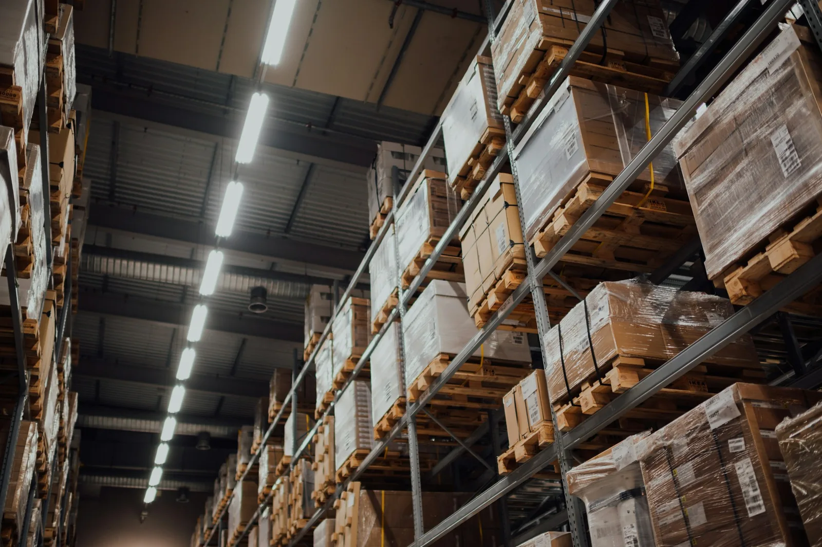 Cardboard shipping boxes stacked on warehouse racking